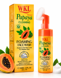 Yellow WKL Papaya Cleaning Foaming Face Wash box and matching orange pump bottle with papaya image and green leaves, plus fresh papayas nearby.