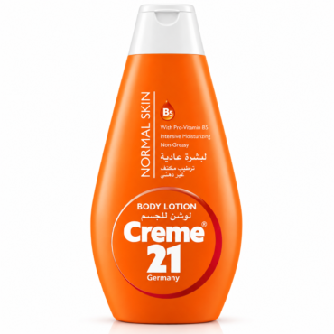 Orange bottle of Creme 21 body lotion with white cap, labeled 'Germany' and Arabic text on the front (informative product image).