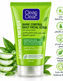 Green Clean & Clear Shine Control Daily Facial Scrub tube with natural beads, 150 ml, beside lime wedges and leaves.