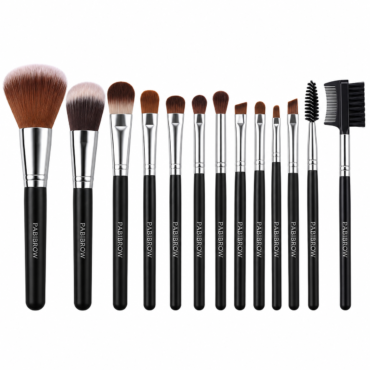 Set of makeup brushes with black handles and silver ferrules lined up from large powder brush to small detail brushes.