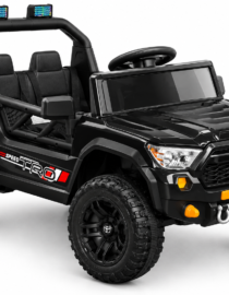 Black kids ride on toy off road truck with large rugged tires orange accents and roof mounted lights