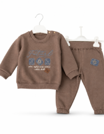 Three kids loungewear sets on hangers in beige and brown colors