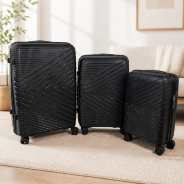 Three black hard-shell suitcases of different sizes with diagonal line patterns and wheels, standing upright on a white backdrop (travel luggage set)