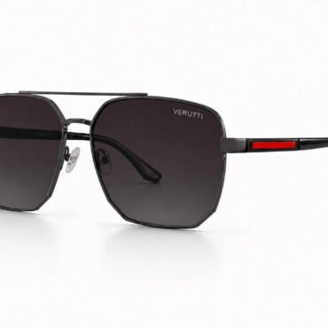 Sunglasses with black metal frames, dark gradient octagonal lenses, and a slim red accent on the temple (Verutti branding visible).