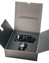 Open black display box with dark sunglasses inside