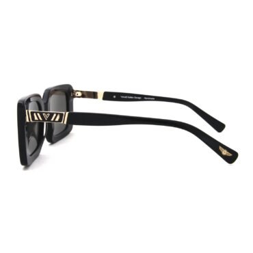 Close-up of black square-frame sunglasses with gold-tone temples; visible logo on the arm and subtle branding on the temple.