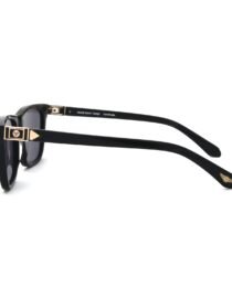 Black sunglasses with thick black frames and gold tone metal accents on the hinges and temple tips logoed branding visible on the side
