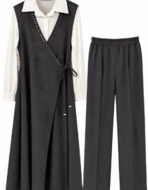 Two piece womens outfit a white long sleeve blouse under a black wrap dress with a tie plus matching black pants with an elastic waistband