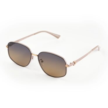 Brown aviator-style sunglasses with gradient lenses resting on a white surface.
