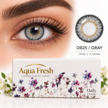 Close-up of a gray contact lens eye with Aqua Fresh packaging showing "Daily 2 Lenses" and D825/GRAY logo on the right side.