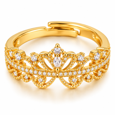Gold ring with an intricate tiara-inspired design encrusted with small diamonds on a white background
