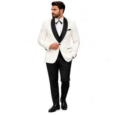 Man in a white dinner jacket with black satin lapels, black bow tie, and black trousers, posing with one hand on his jacket.