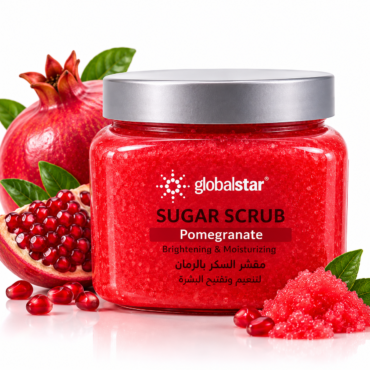 Globalstar Sugar Scrub in a red jar with a silver lid, labeled Pomegranate, surrounded by pomegranate fruit and seeds.
