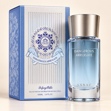 Blue perfume box with silver panels and an ornate crest beside a glass fragrance bottle labeled 'Dangerous Arrogate'. Whether this is a luxury scent, the composition focuses on the product and branding, not people.
