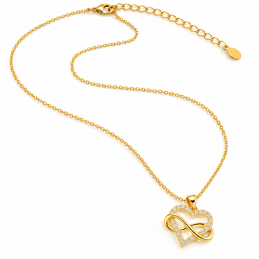 Gold necklace with a diamond-studded heart-infinity pendant on a white background, close-up.