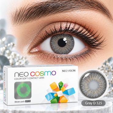 Close-up of an eye wearing a gray contact lens; foreground shows the Neo Cosmo color soft contact lens box and a lens case on a marble surface.