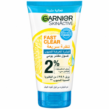 Garnier SkinActive Fast Clear daily face wash tube with lemon imagery and blue cap, 2% salicylic acid label (Arabic text shown).