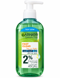 Green Garnier SkinActive Fast Clear cleanser bottle with pump dispenser and Arabic label