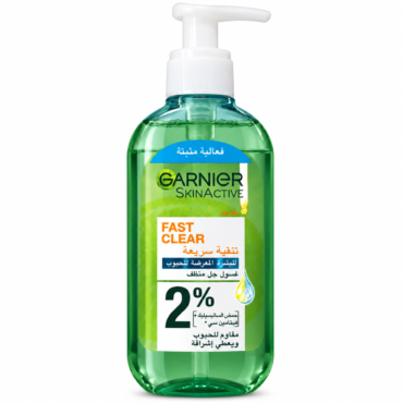 Green Garnier SkinActive Fast Clear cleanser bottle with pump dispenser and Arabic label