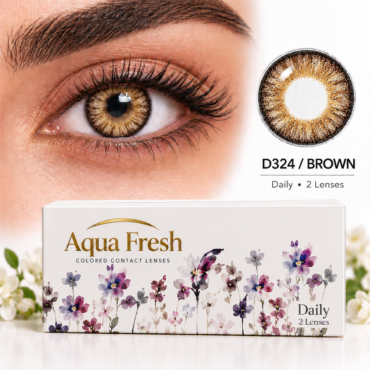 Close-up of a brown iris wearing a colored contact lens, with Aqua Fresh Daily 2 Lenses packaging.