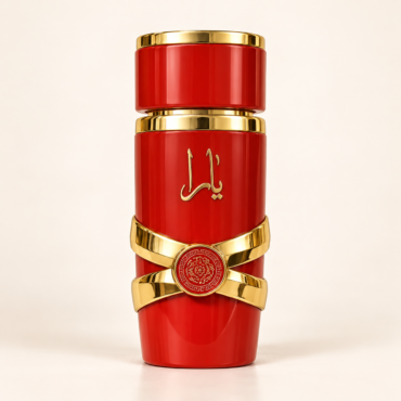 Red cylindrical perfume bottle with gold caps and a gold middle band, featuring Arabic script and a circular emblem (luxury fragrance display).