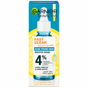 Garnier SkinActive Fast Clear booster serum for acne-prone skin in blue packaging with a dropper bottle, 4% Niacinamide text visible.