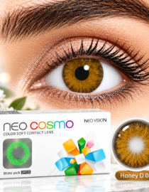 Close up of a golden brown eye wearing a colored contact lens beside Neo Cosmo color soft contact lens box and a lens case labeled Honey D038