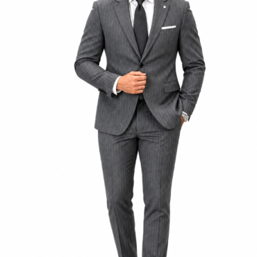 Man in a gray pinstripe suit with white shirt and black tie, adjusting his jacket against a white background.