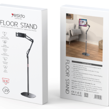 Two white Yesido Floor Stand packaging boxes left box shows an illustrated diagram of an adjustable tablet stand with branding and specs right box features a photo of the stand holding a mounted tablet in a living room