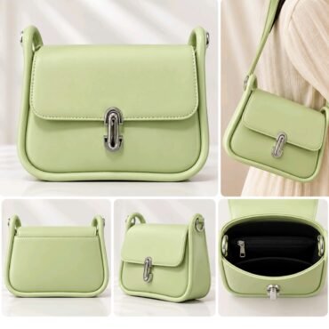 Mint green structured handbag with a silver clasp shown from the front on a white surface