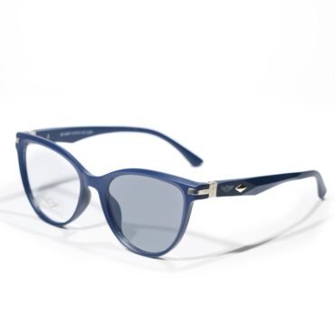 Blue sunglasses with rectangular blue frames and metal accents rest on a white surface, close-up shot.